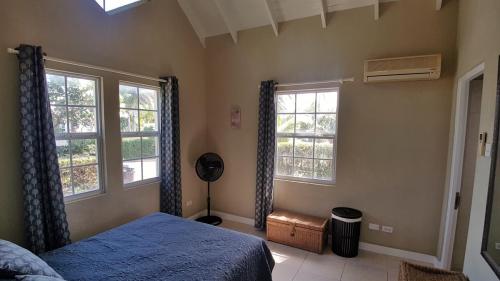 Master bedroom with air con and fan